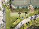 Aerial view of bocce ball court, lush landscaping and shaded seating areas at 7641 Quinto Dr, Sarasota, FL 34238