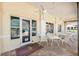 Outdoor cafe patio with ceiling fans, tables, and chairs at 7641 Quinto Dr, Sarasota, FL 34238