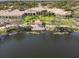 Elegant clubhouse with lakefront gazebo and manicured landscaping offers a picturesque setting at 7641 Quinto Dr, Sarasota, FL 34238