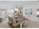 The dining room features a modern chandelier, a table with seating for six, and an open layout at 7641 Quinto Dr, Sarasota, FL 34238