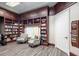 Cozy library featuring built-in bookshelves and comfortable seating at 7641 Quinto Dr, Sarasota, FL 34238