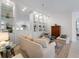 Bright living room featuring elegant built-in shelving, comfortable seating, and stylish decor at 7641 Quinto Dr, Sarasota, FL 34238