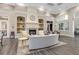 Elegant lounge area with a fireplace, stylish furnishings, and tasteful decor at 7641 Quinto Dr, Sarasota, FL 34238