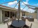 The patio features a dining set and seating area perfect for entertaining or relaxing outside at 7641 Quinto Dr, Sarasota, FL 34238