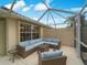 Enjoy the outdoors in this shaded patio with stylish seating and a tranquil atmosphere at 7641 Quinto Dr, Sarasota, FL 34238