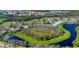 Aerial view of community highlighting condos, a golf course, and natural beauty at 802 Montrose Dr # 204, Venice, FL 34293