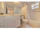 Functional bathroom with a shower-tub combo, modern fixtures, and neutral-toned tile flooring at 802 Montrose Dr # 204, Venice, FL 34293