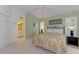 Inviting bedroom with bright colors, comfortable bed, ensuite bathroom, and ample natural light at 802 Montrose Dr # 204, Venice, FL 34293