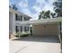 View of a covered carport with two storage spaces for units 104 and 204 at 802 Montrose Dr # 204, Venice, FL 34293