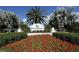 Welcoming entrance to The Plantation Golf & Country Club, featuring lush landscaping and clear signage at 802 Montrose Dr # 204, Venice, FL 34293