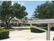 Exterior view of the townhomes and carports from a distance at 802 Montrose Dr # 204, Venice, FL 34293