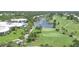Expansive golf course with green fairways and serene lake views within a beautiful community setting at 802 Montrose Dr # 204, Venice, FL 34293