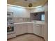 Bright kitchen with white cabinets, modern appliances, and a decorative backsplash for a clean, coastal aesthetic at 802 Montrose Dr # 204, Venice, FL 34293