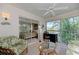 Relaxing lanai features tile floor, wicker furniture, and lovely views of the bedroom and outdoors at 802 Montrose Dr # 204, Venice, FL 34293