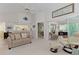 Spacious living room with comfortable seating, a view to the kitchen, and seamless flow to the outdoor patio at 802 Montrose Dr # 204, Venice, FL 34293