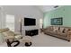 Living room with comfortable seating, large windows, and a neutral color scheme, offering a relaxing atmosphere at 802 Montrose Dr # 204, Venice, FL 34293
