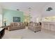 Cozy living room with an open design, showcasing views into the adjacent kitchen and dining spaces at 802 Montrose Dr # 204, Venice, FL 34293