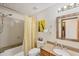 Cozy bathroom featuring granite counter, neutral tile and framed mirror at 8160 Glenbrooke Ct, Sarasota, FL 34234