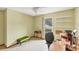 Bedroom used as a home office with tile flooring and natural light at 8160 Glenbrooke Ct, Sarasota, FL 34234