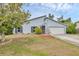 Charming single-Gathering home featuring a well-maintained lawn and an attached two-car garage at 8160 Glenbrooke Ct, Sarasota, FL 34234