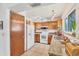 Bright kitchen with stainless steel sink, granite countertops, and white appliances at 8160 Glenbrooke Ct, Sarasota, FL 34234