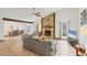 Spacious living room with a stone fireplace, tile floors, and lots of natural light at 8160 Glenbrooke Ct, Sarasota, FL 34234