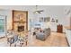 Bright and airy living room with a stone fireplace and tile floors at 8160 Glenbrooke Ct, Sarasota, FL 34234