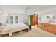 Spacious main bedroom with French doors leading to the pool area at 8160 Glenbrooke Ct, Sarasota, FL 34234