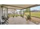 Spacious screened patio featuring lots of room for plants and a seating area at 8160 Glenbrooke Ct, Sarasota, FL 34234