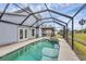 Gorgeous enclosed pool and spa area with easy access to the home's interior at 8160 Glenbrooke Ct, Sarasota, FL 34234