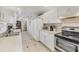 Efficient kitchen with white appliances, tile floors, and lots of counter space and storage at 9366 Westminster Ave, Englewood, FL 34224