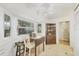Kitchen boasts a cozy breakfast nook with natural light, neutral tile flooring, and built-in shelving at 9366 Westminster Ave, Englewood, FL 34224