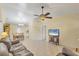 Inviting living space featuring neutral walls, tile floors, and an open layout to the dining area at 9366 Westminster Ave, Englewood, FL 34224