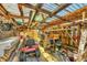 Rustic backyard shed with a wooden roof and storage for tools and lawn equipment at 9366 Westminster Ave, Englewood, FL 34224