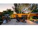 Outdoor dining set with a gas grill set on a stone patio for enjoying the outdoors at 1010 68Th Nw St, Bradenton, FL 34209