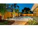 Landscaped backyard featuring an in-ground pool and a dining set to enjoy the outdoors at 1010 68Th Nw St, Bradenton, FL 34209