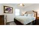 Bedroom features a ceiling fan, decorative pillows, and neutral decor at 1010 68Th Nw St, Bradenton, FL 34209