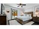 Comfortable bedroom with ceiling fan, decorative rug, and sliding glass door leading to backyard pool at 1010 68Th Nw St, Bradenton, FL 34209