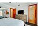 Relaxing bedroom with a tv and access to the bathroom at 1010 68Th Nw St, Bradenton, FL 34209