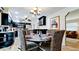 Dining room with a view of the kitchen with a round dining table at 1010 68Th Nw St, Bradenton, FL 34209