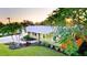 Charming single-story home with a well-manicured lawn and mature tropical landscaping at 1010 68Th Nw St, Bradenton, FL 34209