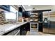 Modern kitchen with stainless steel appliances, granite countertops, and a stylish backsplash at 1010 68Th Nw St, Bradenton, FL 34209