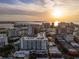 Beautiful aerial shot capturing sunset over the cityscape with buildings and boats at 111 S Pineapple Ave # 813, Sarasota, FL 34236