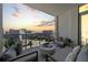 Relaxing balcony scene featuring comfortable seating and city views, perfect for enjoying serene moments with a beautiful sunset backdrop at 111 S Pineapple Ave # 813, Sarasota, FL 34236