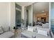 Inviting balcony with stylish seating and decor, seamlessly connecting indoor and outdoor living spaces with sliding glass doors at 111 S Pineapple Ave # 813, Sarasota, FL 34236
