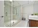 Modern bathroom with glass-enclosed shower and marble tile flooring at 111 S Pineapple Ave # 813, Sarasota, FL 34236