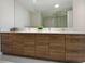 Bathroom featuring a spacious vanity with double sinks and a large mirror at 111 S Pineapple Ave # 813, Sarasota, FL 34236