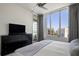 Bright bedroom featuring large window view and minimalist modern design at 111 S Pineapple Ave # 813, Sarasota, FL 34236