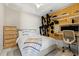 Modern bedroom with a decorative wall organizer, sleek desk, and bright, natural light at 111 S Pineapple Ave # 813, Sarasota, FL 34236