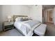 Cozy bedroom featuring neutral tones and a plush bed with coordinated bedding at 111 S Pineapple Ave # 813, Sarasota, FL 34236